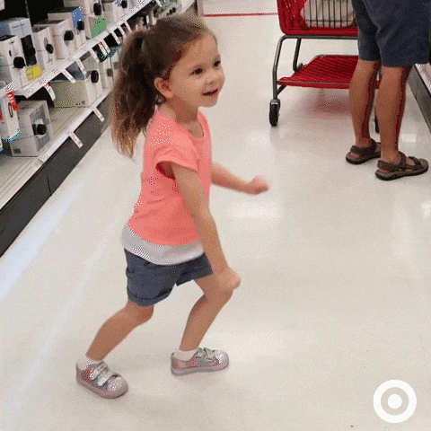 Ad gif. Little girl excitedly dancing in an aisle at a Target store.