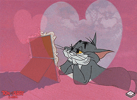 Cartoon gif. Jerry from Tom and Jerry lounging and gazing at a picture frame adoringly, as pink hearts surround him. 