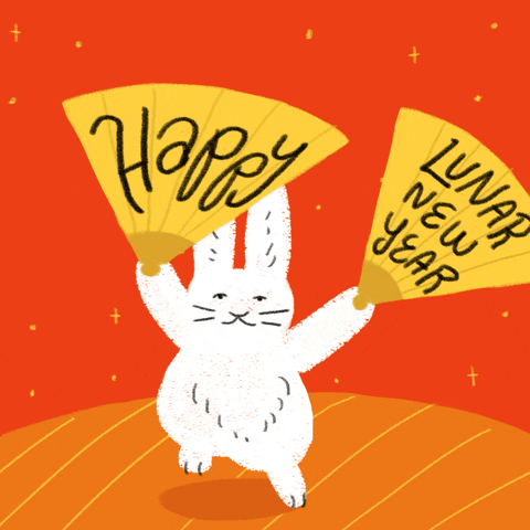 Illustrated gif. White rabbit in the style of a children's book hops up and down on a persimmon red background with stars and orange fireworks, waving two golden paper fans in the air, reading "Happy," and, "Lunar New Year."