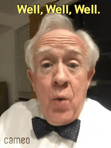 Celebrity gif. Leslie Jordan looks at us with raised eyebrows. Text, "Well, well, well."