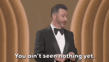 Oscars 2024 gif. Jimmy Kimmel shakes his head and twiddles his thumbs while saying, "You ain't seen nothing yet."