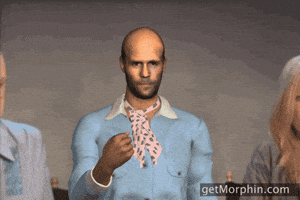 Digital art gif. A Jason Statham avatar wears a powder blue jacket and neckerchief as he looks blankly at us and tosses gold confetti into the air. 
