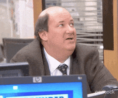The Office gif. Brian Baumgartner as Kevin in The Office sits at a desk. His semi-bald head gleams as he smirks and nods up at someone. Text reads, "He's not the sharpest guy in the drawer."