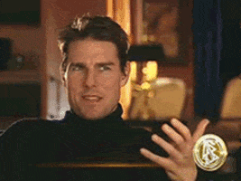 Celebrity gif. In interview setting, Tom Cruise breaks into laughter and claps his hands.