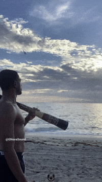 Playing the Didgeridoo On The Beach at Sunrise #Ca