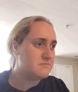 Celebrity gif. Influencer Brittany Broski looks uncertain, weighing her options. Her face changes from skeptical to interested, but then she shakes her head, “no.”