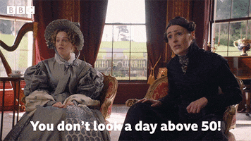 TV gif. Suranne Jones as Anne in Gentleman Jack.  She leans forward in shock to glance at the person she's speaking with before declaring, "You don't look a day over 50!"  