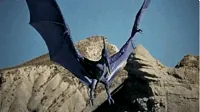 pterosaur flapping its wings in the mountains