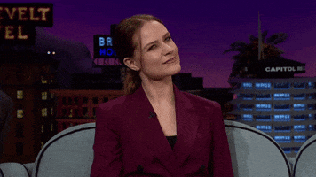 Late night gif. Evan Rachel Wood with a stern look on her face, tosses her head side to side, playing perplexed, raising a finger to her mouth as if considering.