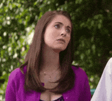 TV gif. Alison Brie as Annie in Community tilts her head and looks up with pleading, puppy dog eyes.