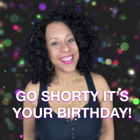 Video gif. Woman looks at us excitedly, squeezing her fists and making spirit fingers against a glittery background, saying, "Go shorty it's your birthday!'