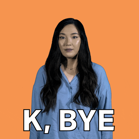 Video gif. A woman gives us a grimace before raising a hand and waving goodbye. She looks uncomfortable and awkward and the text reads, "K, Bye."