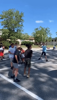 Elementary School Plays Inclusive Basketball Game With Student in Wheelchair