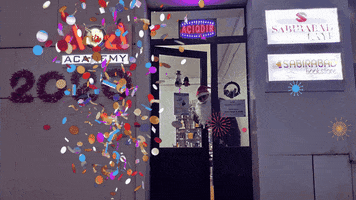 Photo gif. Confetti falls in front of the four zero four academy store front. A man peeks his head out of the door with a Santa hat and beard. Text, “Bu il kitag elinizden düşmesin! Yeri jlinig mubarak. Sabirabad bookstore.”