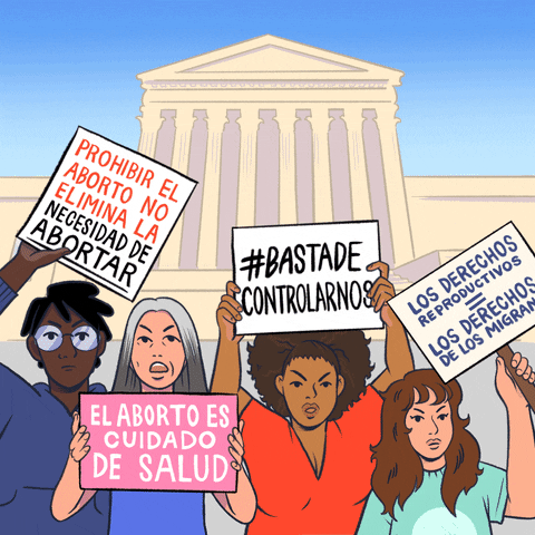 Digital art gif. Diverse group of angry women wave signs in front of the Capitol Building. The signs read, “Prohibir el aborto no elimina la necesided de abortar,” “El aborto es cuidado de salud,” “#Bastade controlarnos,” and “Los Derechos reproductivos equals los derechos de los migranos.”