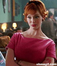 TV gif. Christina Hendricks as Joan Harris in Mad Men crosses her arms and looks someone up and down judgmentally.