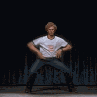 Movie gif. Jami Roquai as Napoleon Dynamite awkwardly gyrates and wiggles his hand up as he attempts to dance. His face is full of determination and he stamps his legs together, getting ready for another dance move.