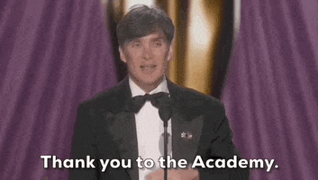 Oscars 2024 GIF. Cillian Murphy wins Best Actor. He motions his arm outward from his chest and says, "Thank you to the Academy."