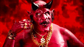 Music video gif. Satan in Rob Zombie’s The Life and Times of A Teenage Rock God looks at us pretending to fan himself from the hot flames of hell, as if mocking us.
