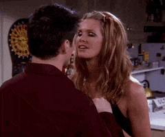 Friends gif. Elle MacPherson as Janine pauses after pulling back from a kiss with Matt Leblanc as Joey and says, "Happy New Year."