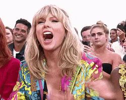 Celebrity gif. Taylor Swift leans forward and claps energetically while shouting, "Yes!"
