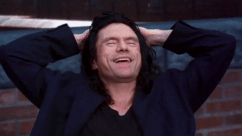 Tommy Wiseau laughing and saying “what a story mark”