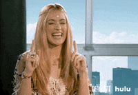 Cat Deeley saying 'yes' and pointing up with two fingers