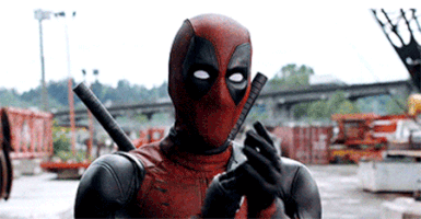 Movie gif. Deadpool gives us some (possibly sarcastic) applause.