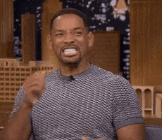 Celebrity gif. Will Smith bites his nails nervously then claps his hands in excitement.