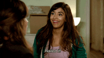 TV gif. Hannah Simone as Cece in New Girl smiles and says, “Nailed it,” as she raises both hands up for a hesitant high five.