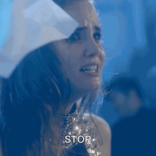 Video gif. Brunette woman dressed in sparkly top screams, "Stop," contorting her teary face into a distressed grimace.