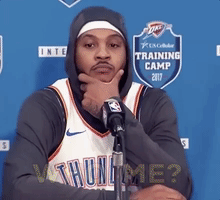 Sports gif. Wearing an Oklahoma City Thunder jersey, Carmelo Anthony looks confused and asks, “Who me?” Then, he smiles and laughs.