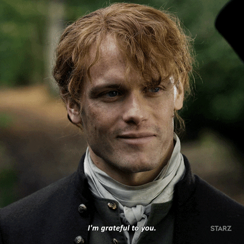 TV gif. Sam Heughan as Jamie Fraser in Outlander nods with a half-smile. Text, "I'm grateful to you."