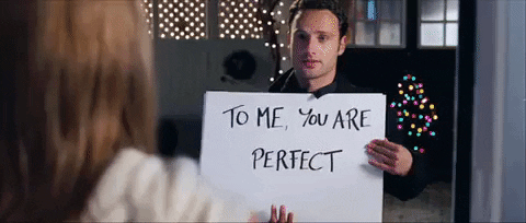 I don't really like that genre but if we have to it would be something like Love Actually.

It shows more "life" than other movies with overly romanticised and dramatised things.

Even with some storyline people don't like (as below) at least he was honest and her gesture was one of hope, for his future, it seems to be misconstrued...generally.