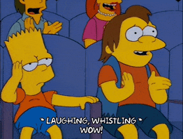 The Simpsons gif. Bart and Nelson sit in an auditorium amongst a cheering crowd. Bart looks bored, anxiously shifting in his seat while Nelson claps enthusiastically and whistles. Text, “Laughing, whistling. Wow!”