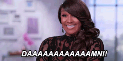 Reality TV gif. With hair styled over her left eye, Jackie Christie from BBWLA gives us an impressed reaction. Text, "A long, drawn-out 'damn!'"