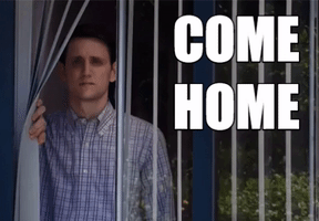 TV gif. Zach Woods as Jared in Silicon Valley holds aside window blinds as he stares longingly ahead. Text, "Come Home."