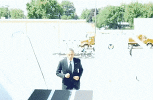 Politics gif. Barack Obama jogs up stairs leading up to Air Force One, then turns around to wave.