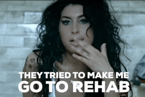 Music video gif. Amy Winehouse looks ahead as she sings the words that appear. Text, "They tried to make me go to rehab but I said no, no, no."