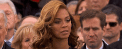 Celebrity gif. Beyonce at Obama’s Presidential Inauguration stands next to Joe Biden and blinks in a way that shows that she's subtly annoyed. Text, “Hashtag can you not.”