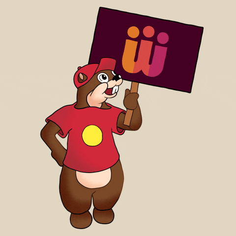 Digital art gif. A smiling woodchuck wearing a cute red baseball cap and a t-shirt hoists a picket sign showing the logo of the Women's March, against a cream background.