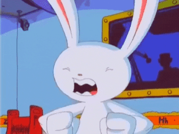 gif of Max from Sam and max, smiling and shaking his hands excitedly.