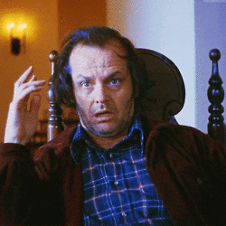Movie gif. Jack Nicholson as Jack Torrance in The Shining, sits reeling in rattled bewilderment.