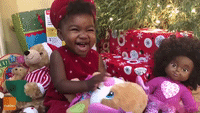 Adorable Tot Shows Off Her Christmas Presents