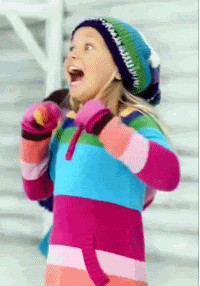 Video gif. A wide-eyed little girl hangs her mouth open in delighted excitement. 
