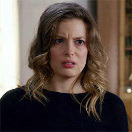 TV gif. Gillian Jacobs as Britta in Community looks at someone off screen and grimaces. 