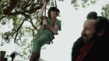 Video gif. A man in a Peter Pan costume slides down a rope before giving us a surprised smile. Text, "Ha ha."