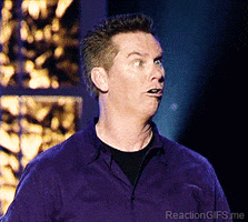 TV gif. Brian Regan looks straight ahead with crossed eyes and mouth partially agape as he twists his head mechanically. He holds his cross-eyed gaze and looks all around him.