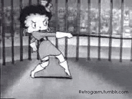 Cartoon gif. Betty Boop is angrily using a whip, lashing at while wearing high heeled boots.