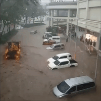 Cars Partially Submerged in Floodwaters in Southern Philippines